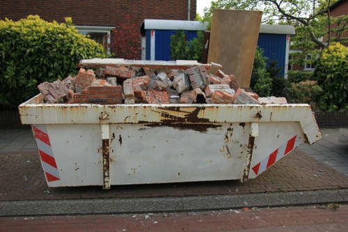 People disposing furniture responsibly in Morden